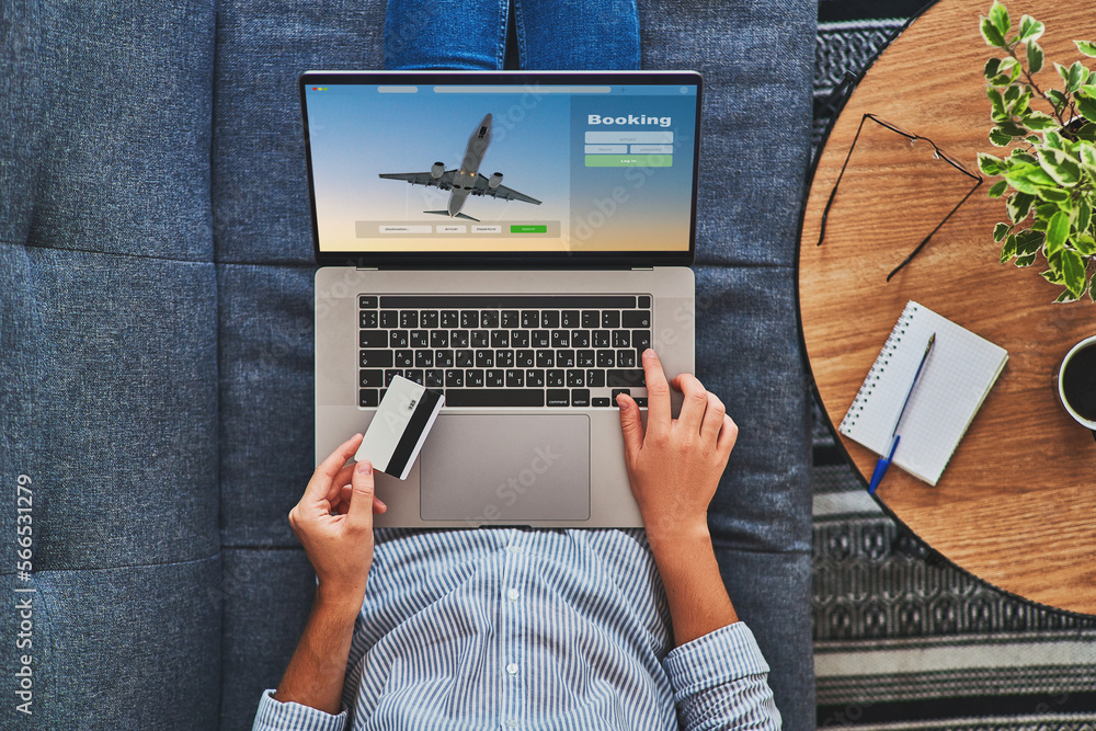 Online booking and buying plane tickets using computer and credit card